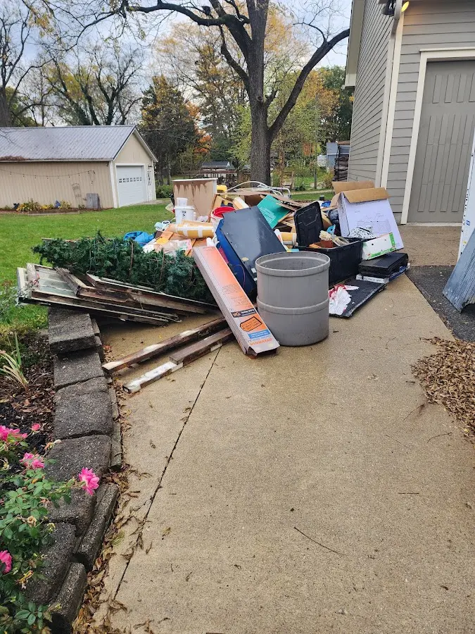 Dumpster being loaded with debris for Demolition Dumpster Rental in Orland Hills